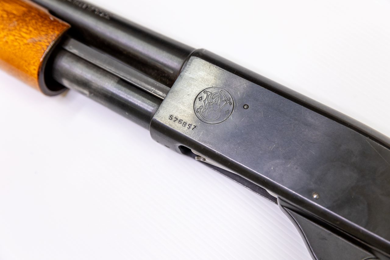 Identification markings on a pump-action shotgun.